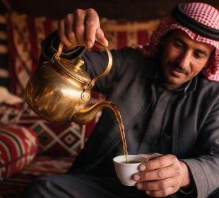 Man pouring tea