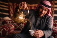 Man pouring tea